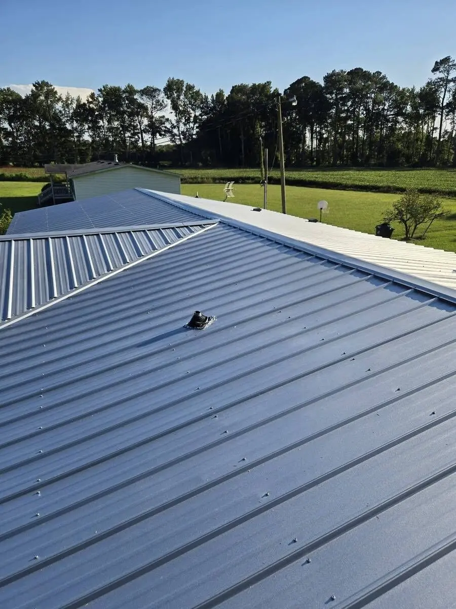 New metal roof with sealed pipe boot flashing